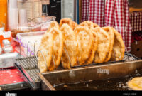 Authentic Hungarian Langos: Crispy Fried Bread with Sour Cream Delight