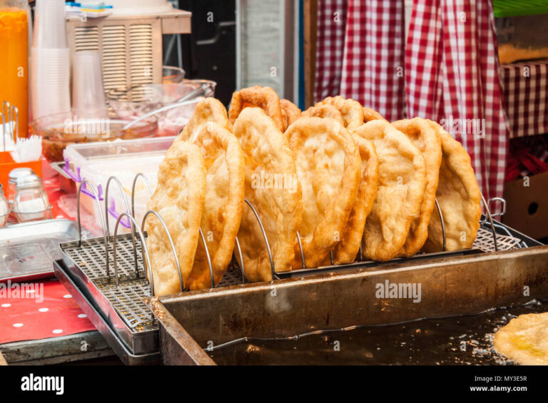 Authentic Hungarian Langos: Crispy Fried Bread with Sour Cream Delight