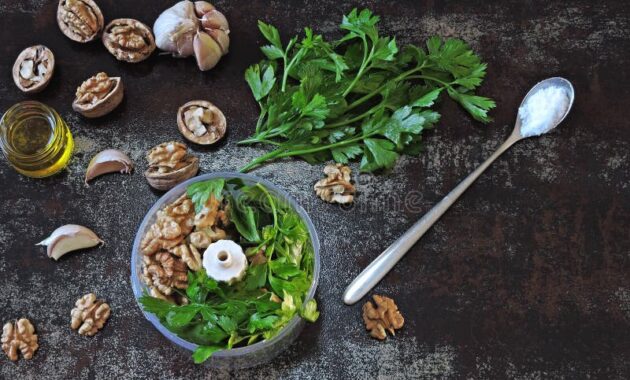 cooking-pesto-sauce-walnuts-parsley-walnut-ingredients-blender-cup-vegan-homemade-jar-top-view-148466664
