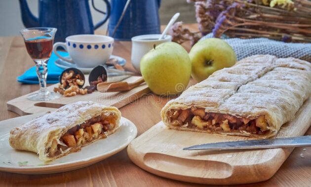 apple-strudel-nuts-raisins-cinnamon-powdered-sugar-homemade-fresh-apples-country-style-132528347