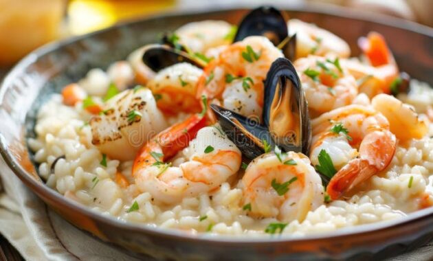 classic-risotto-ai-frutti-di-mare-creamy-seafood-risotto-shrimp-scallops-mussels-squid-finished-white-wine-339214293