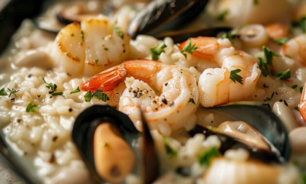 classic-risotto-ai-frutti-di-mare-creamy-seafood-risotto-shrimp-scallops-mussels-squid-finished-white-wine-339372760