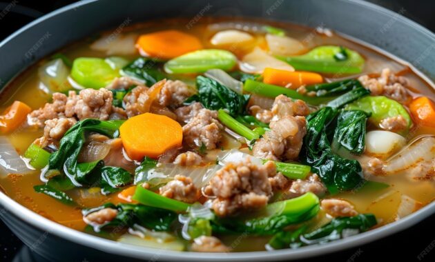Premium Photo Filipino sinigang pork tamarind soup with vegetables in