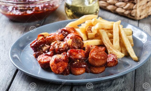Traditional German Currywurst Pieces of Sausage with Curry Sauce